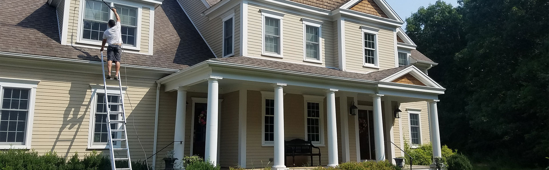 paint the exterior windows of a beige residential home