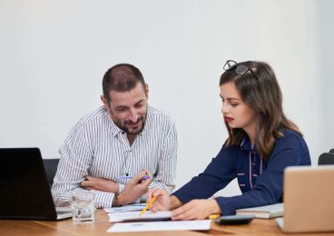 colleagues discussing business data