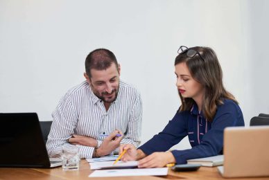 colleagues discussing business data